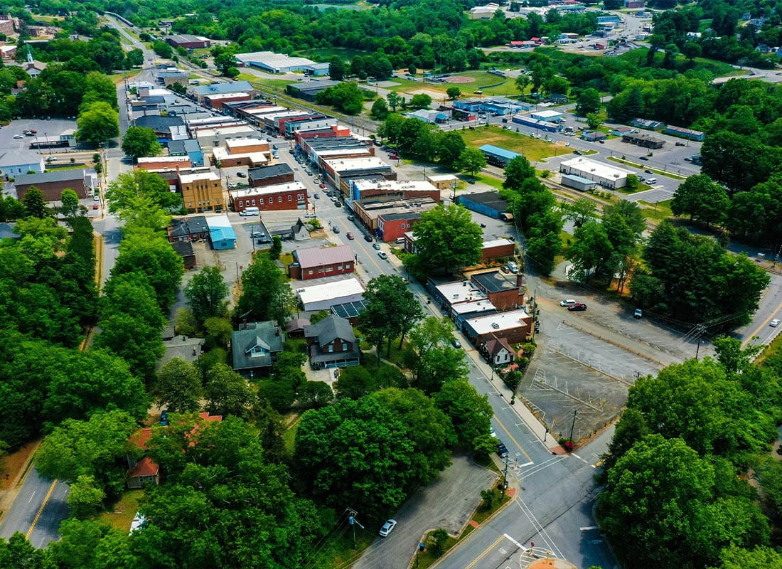 Elkin, NC - Shot of Trees and Small Rural Houses in the Town of Elkin, North Carolina on Spring Day